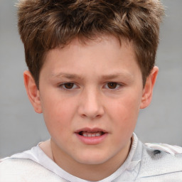 Joyful white child male with short  brown hair and brown eyes