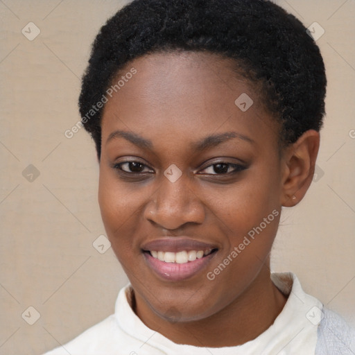 Joyful black young-adult female with short  brown hair and brown eyes