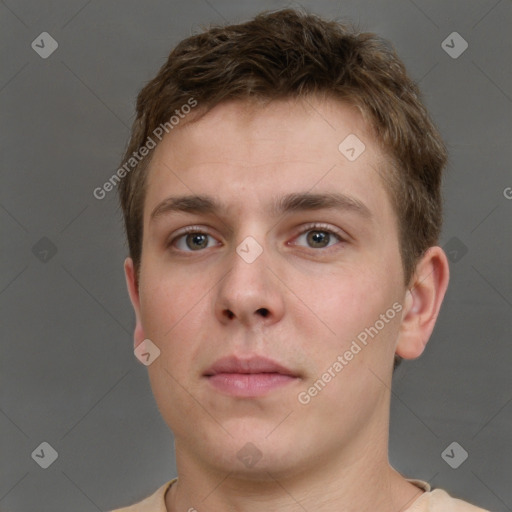 Neutral white young-adult male with short  brown hair and grey eyes