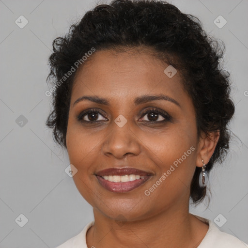 Joyful black young-adult female with medium  brown hair and brown eyes