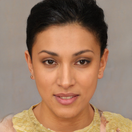 Joyful latino young-adult female with short  brown hair and brown eyes