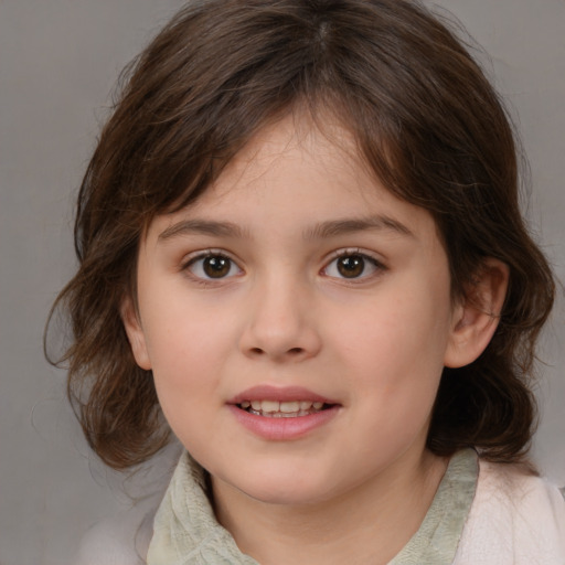 Joyful white child female with medium  brown hair and brown eyes