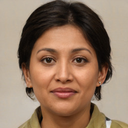 Joyful white adult female with medium  brown hair and brown eyes