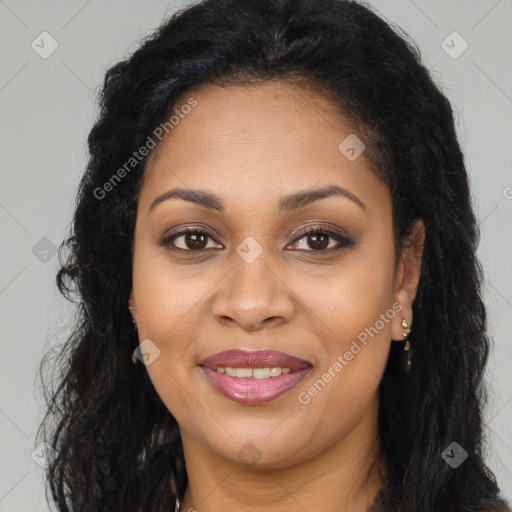 Joyful latino adult female with long  brown hair and brown eyes