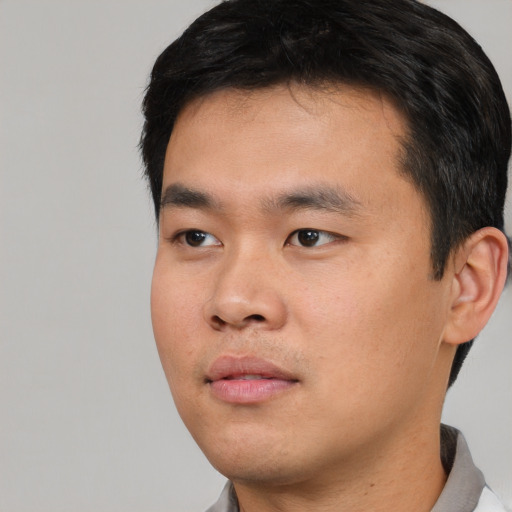 Neutral asian young-adult male with short  black hair and brown eyes