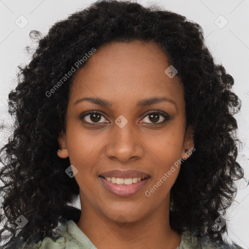 Joyful black young-adult female with long  brown hair and brown eyes