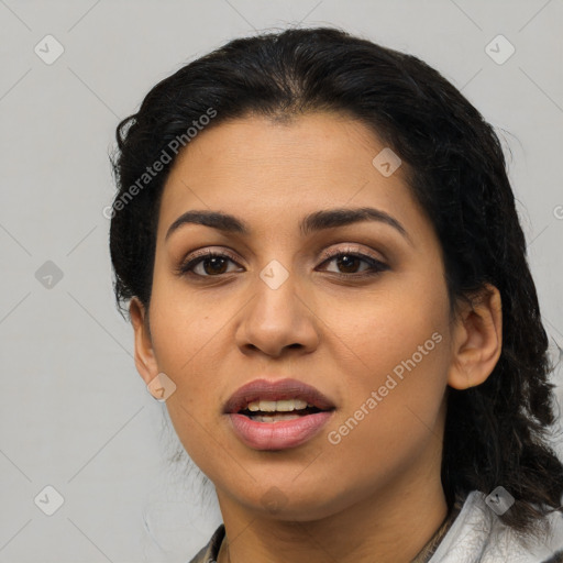 Joyful latino young-adult female with medium  black hair and brown eyes