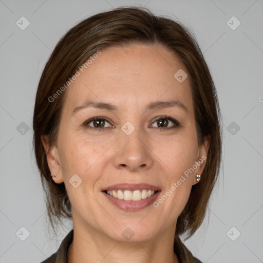 Joyful white adult female with medium  brown hair and brown eyes