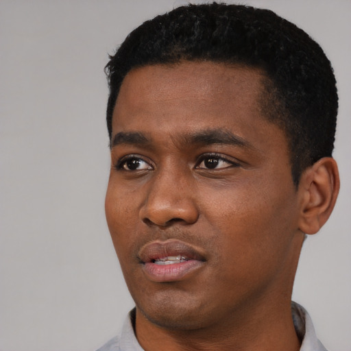 Neutral black young-adult male with short  black hair and brown eyes