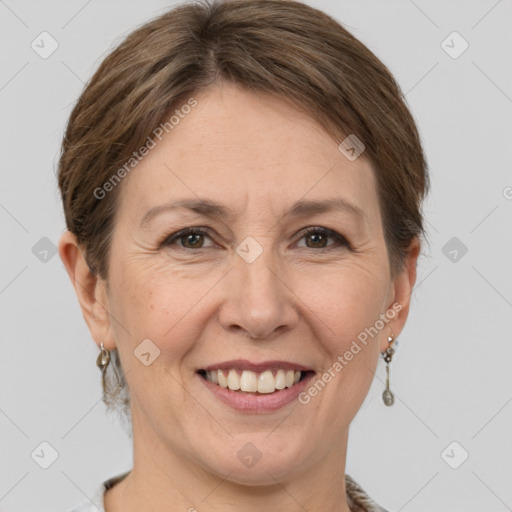 Joyful white adult female with short  brown hair and grey eyes