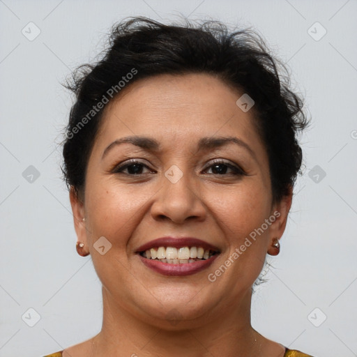 Joyful latino adult female with short  brown hair and brown eyes