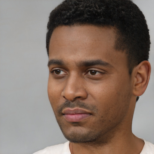 Neutral black young-adult male with short  black hair and brown eyes
