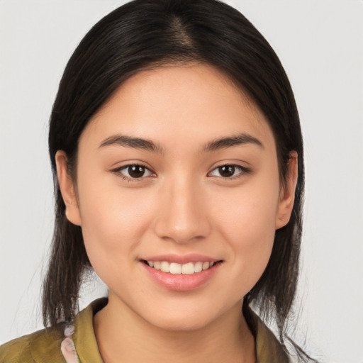 Joyful white young-adult female with medium  brown hair and brown eyes