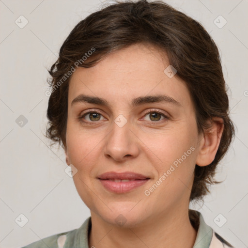 Joyful white young-adult female with medium  brown hair and green eyes