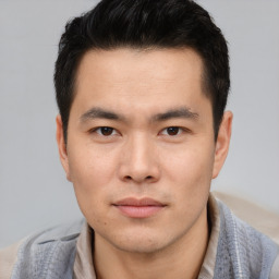Neutral asian young-adult male with short  brown hair and brown eyes