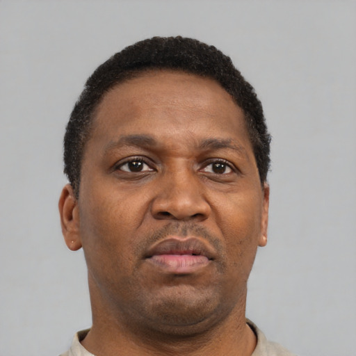 Neutral latino adult male with short  black hair and brown eyes