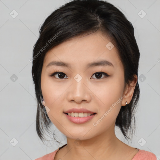 Joyful asian young-adult female with medium  black hair and brown eyes