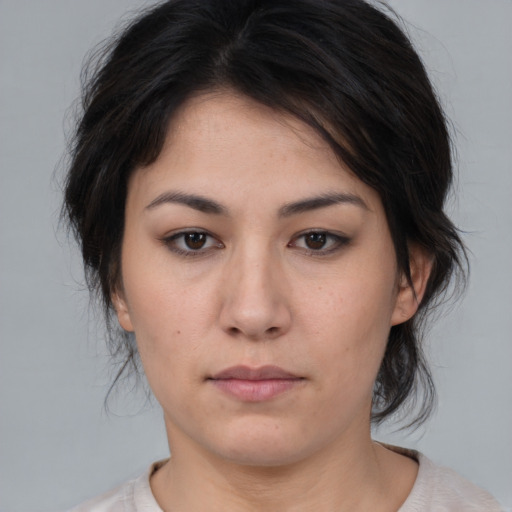 Neutral white young-adult female with medium  brown hair and brown eyes