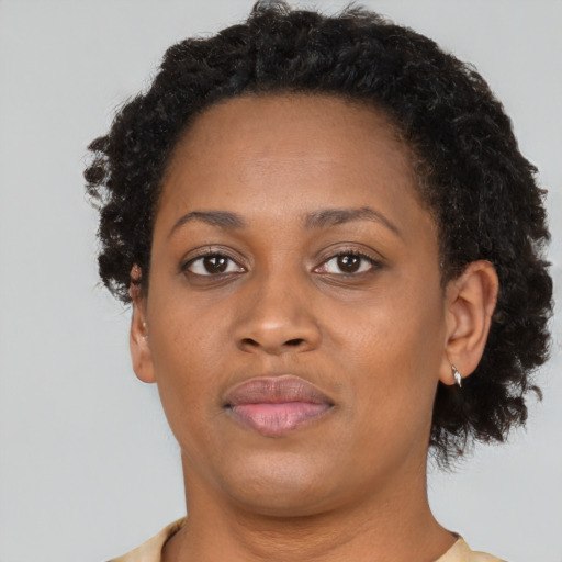 Neutral black adult female with short  brown hair and brown eyes