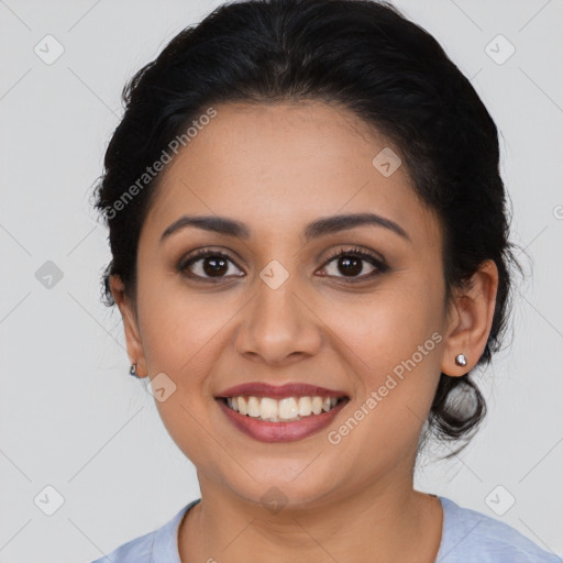 Joyful latino young-adult female with medium  brown hair and brown eyes