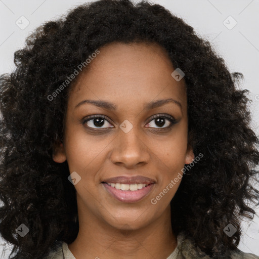 Joyful black young-adult female with long  brown hair and brown eyes