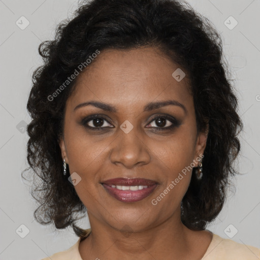 Joyful black adult female with short  brown hair and brown eyes