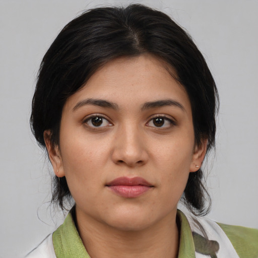 Joyful white young-adult female with medium  brown hair and brown eyes