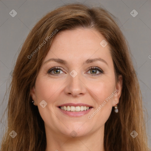 Joyful white young-adult female with long  brown hair and green eyes