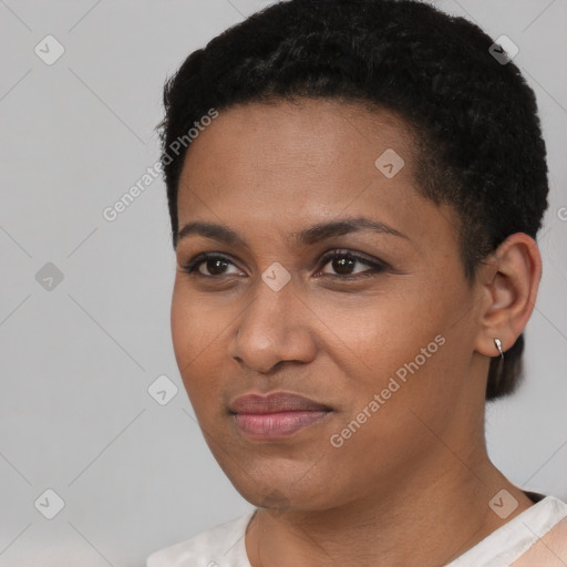 Joyful black young-adult female with short  black hair and brown eyes