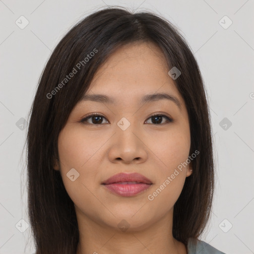 Joyful asian young-adult female with long  brown hair and brown eyes