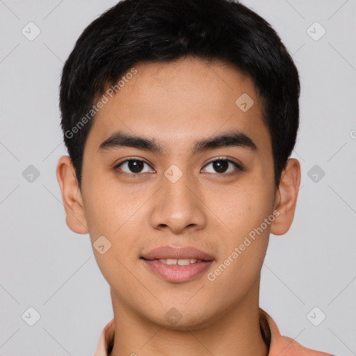 Joyful asian young-adult male with short  black hair and brown eyes