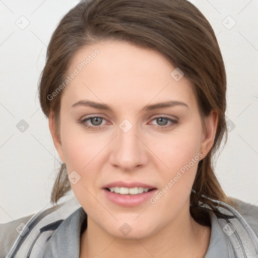 Joyful white young-adult female with medium  brown hair and grey eyes