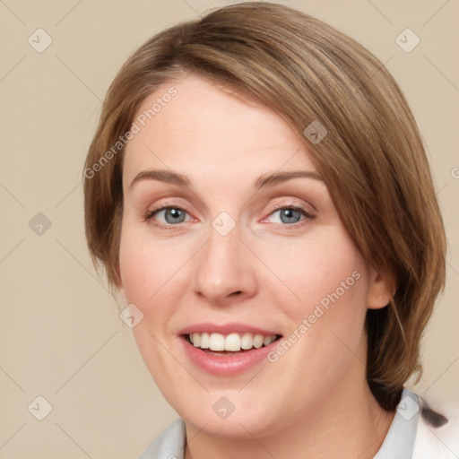 Joyful white young-adult female with medium  brown hair and blue eyes