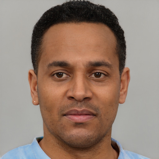 Neutral latino young-adult male with short  brown hair and brown eyes