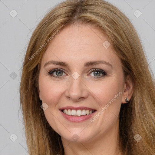 Joyful white adult female with long  brown hair and brown eyes