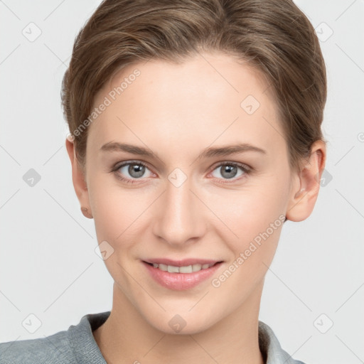 Joyful white young-adult female with short  brown hair and grey eyes