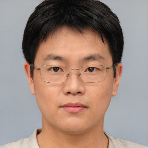 Neutral asian adult male with short  brown hair and brown eyes