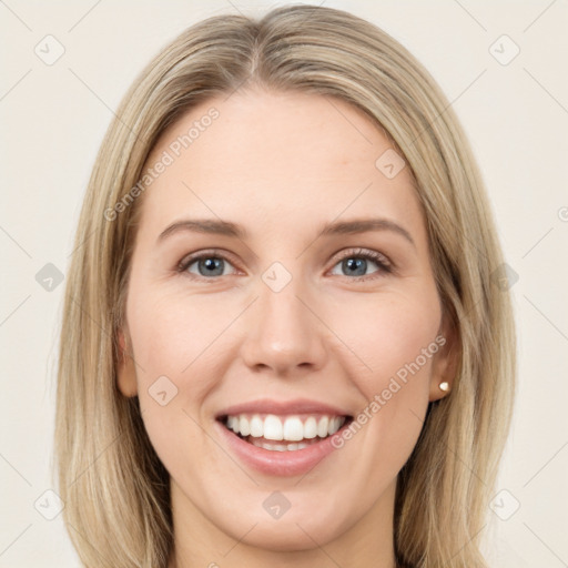 Joyful white young-adult female with long  brown hair and green eyes