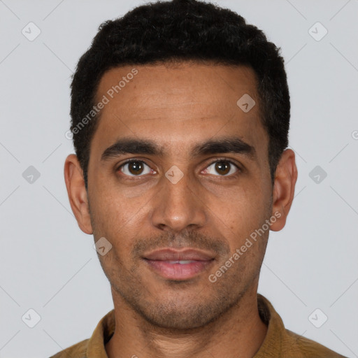 Joyful latino young-adult male with short  black hair and brown eyes