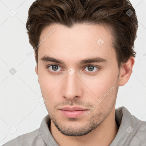 Neutral white young-adult male with short  brown hair and brown eyes