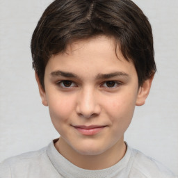 Joyful white child male with short  brown hair and brown eyes