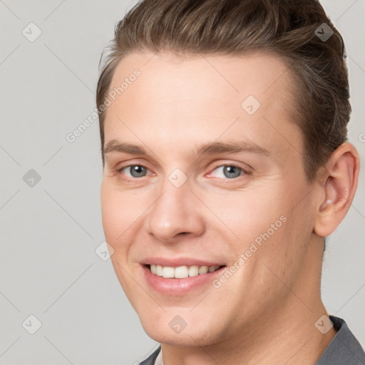 Joyful white young-adult female with short  brown hair and grey eyes