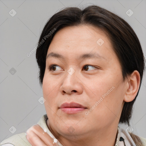 Joyful white adult female with medium  brown hair and brown eyes