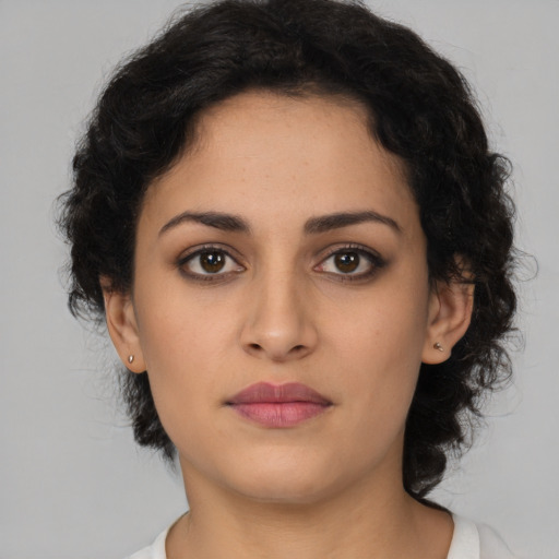 Neutral latino young-adult female with medium  brown hair and brown eyes