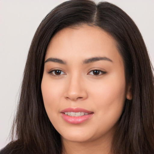 Joyful white young-adult female with long  black hair and brown eyes