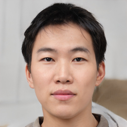 Neutral asian young-adult male with short  brown hair and brown eyes