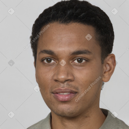 Joyful black young-adult male with short  black hair and brown eyes