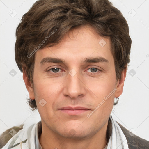 Joyful white adult male with short  brown hair and grey eyes