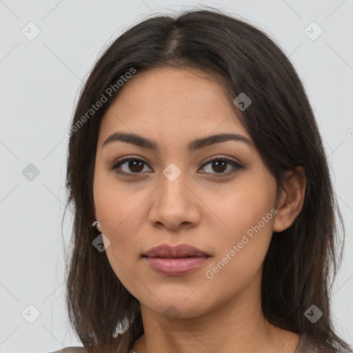 Joyful latino young-adult female with long  brown hair and brown eyes