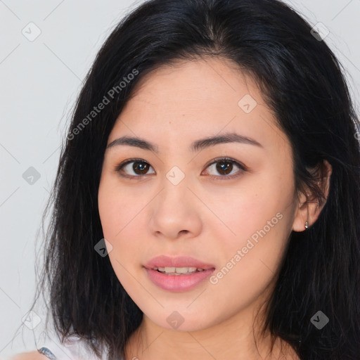 Joyful asian young-adult female with long  brown hair and brown eyes